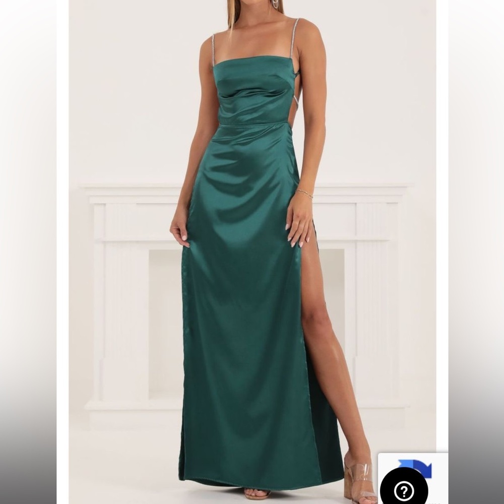 Full-length, spaghetti strap, backless satin hunter green formal dress.